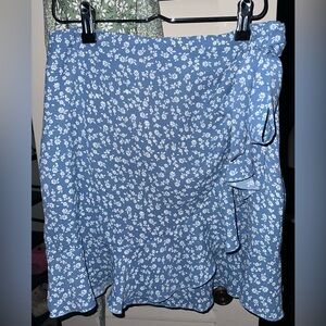 Blue floral skirt with ruffles and tie